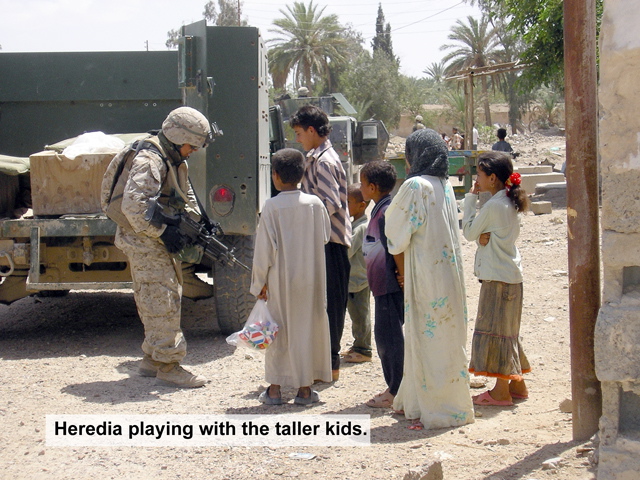 heredia playing with the taller kids_s